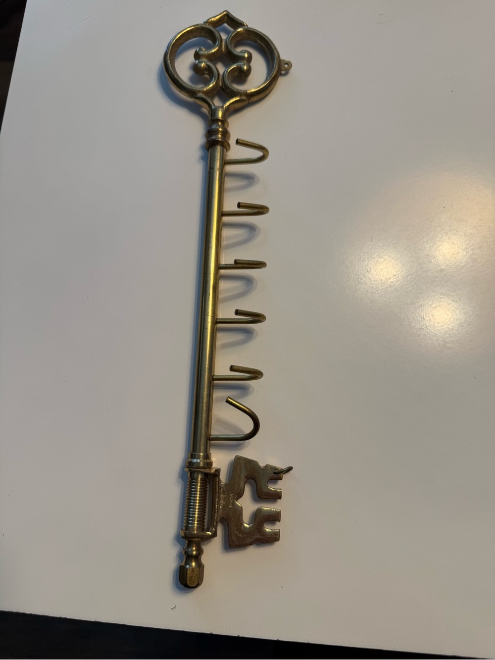 Brass wall hook key holder .